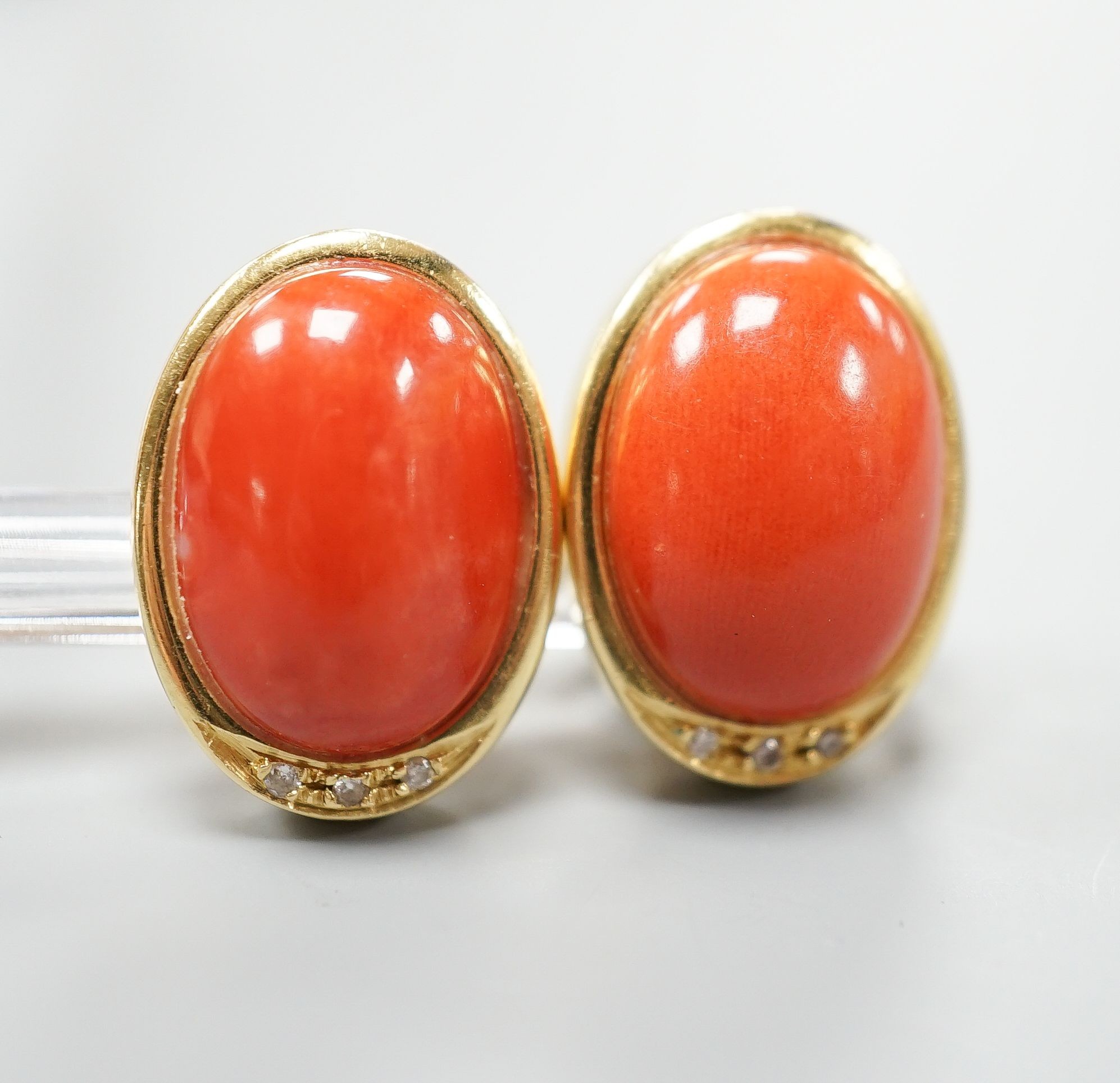 A pair of modern Italian 750 yellow metal a oval coral bead set earrings, 18mm, gross weight 11.7 grams.